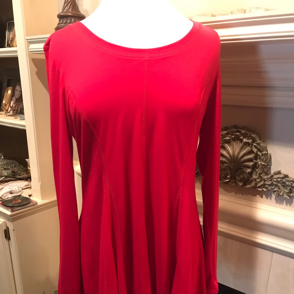 Red knit flared tunic. Princess seaming for a sleek fit.